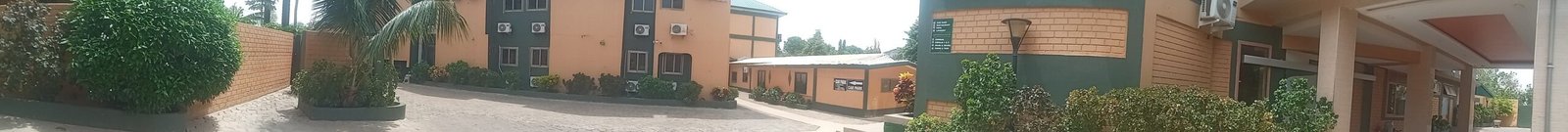 a street scene with a street sign and buildings