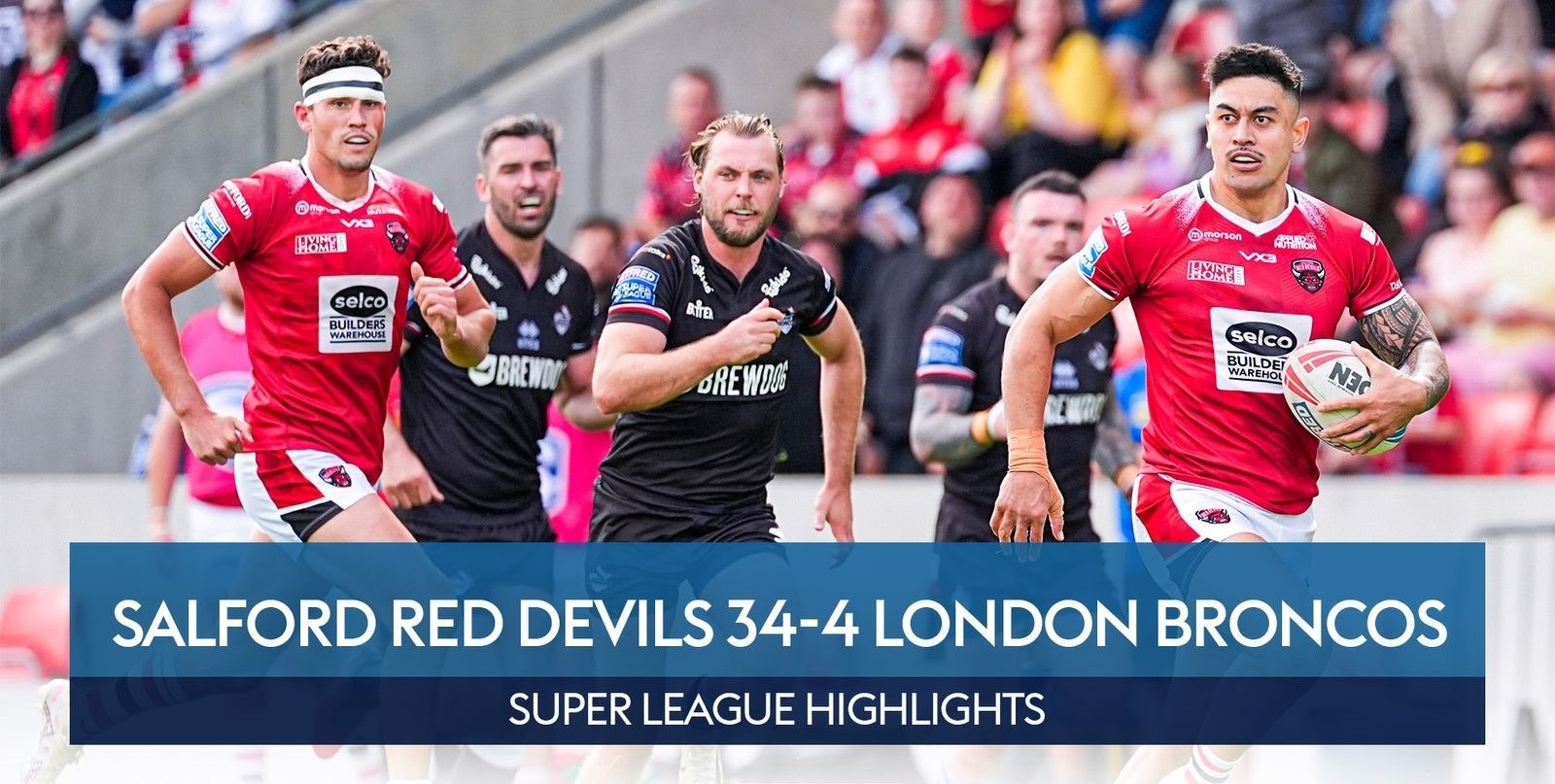 Salford Red Devils and London Broncos - a group of men playing rugby in a stadium